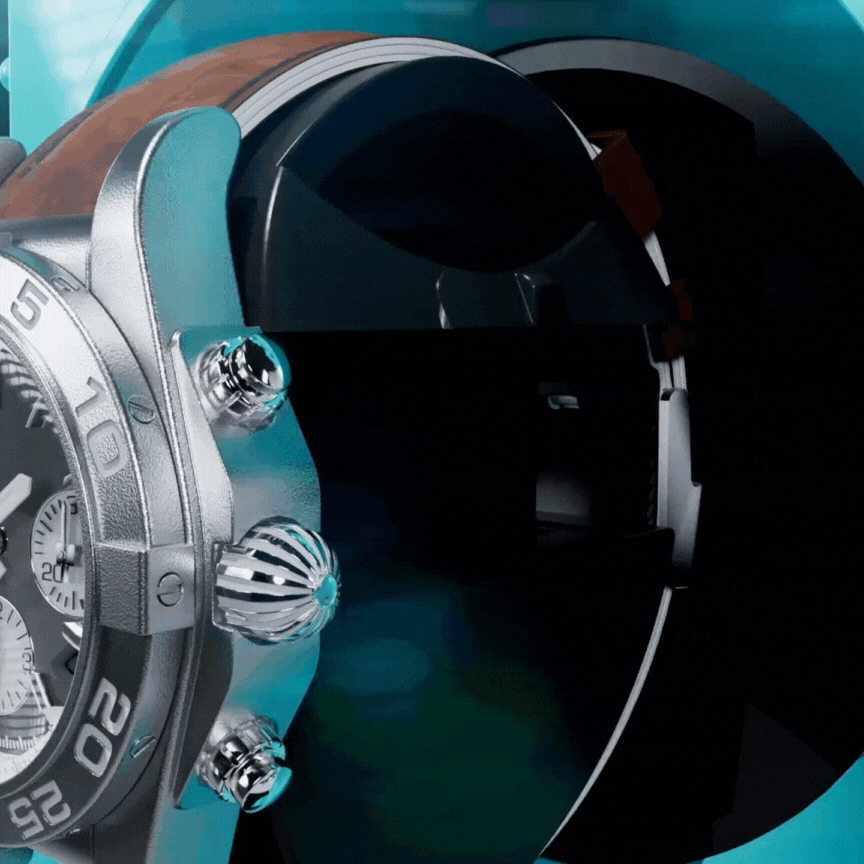 A gif showing a watch being positioned withing the Retro-Bot watch winder. the watch has a grey dial and smaller white sub dials