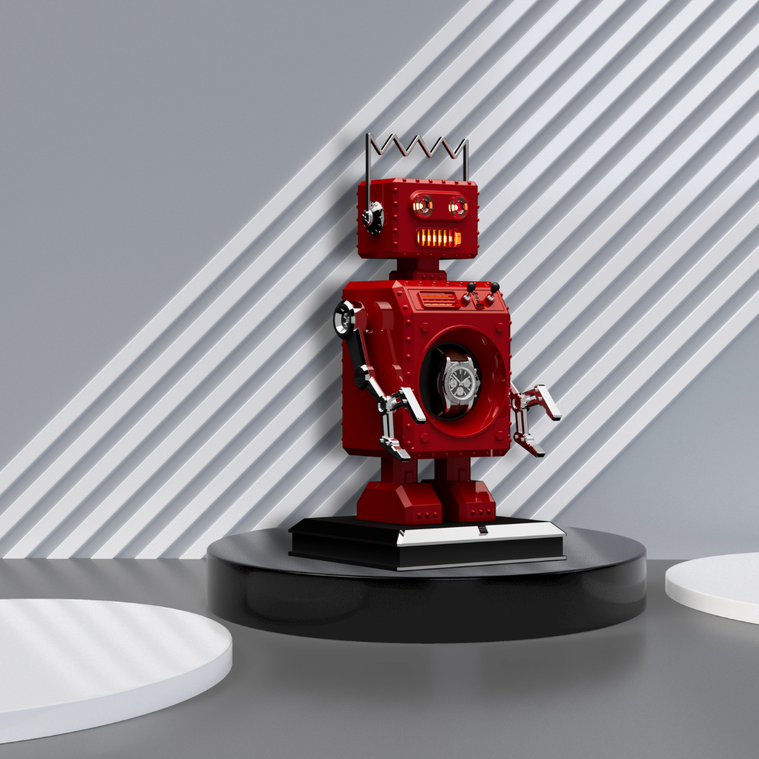 The Retro-Bot robot shaped watch winder red standing on a circular black plinth with a grey background with white stripes