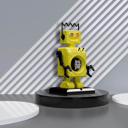 The Retro-Bot robot shaped watch winder in yellow standing on a circular black plinth with a grey background with white stripes